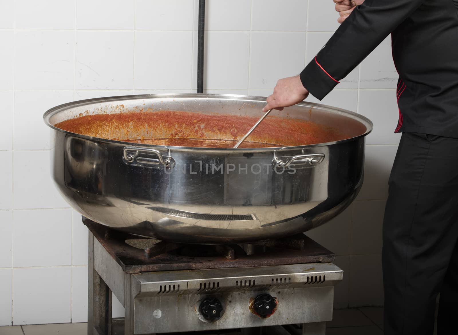 chef cooking beans at commercial kitchen-bean