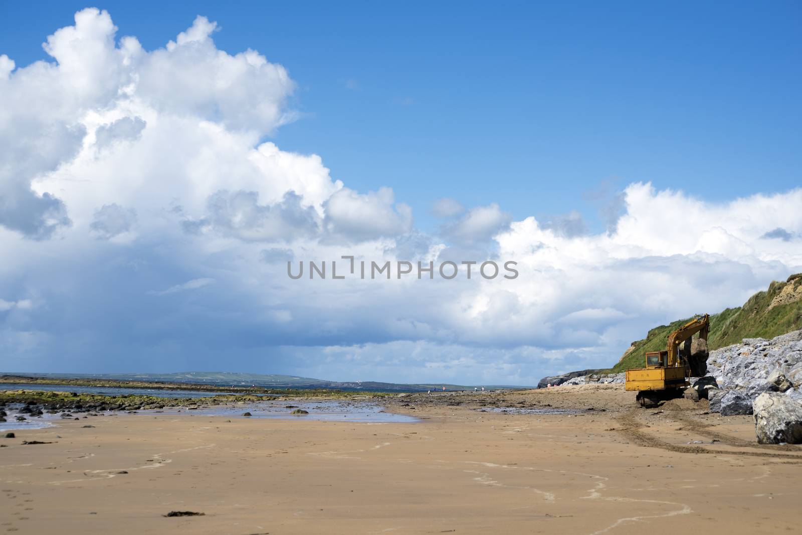 mechanical excavator working on coastal protection for the ballybunion golf course in ireland