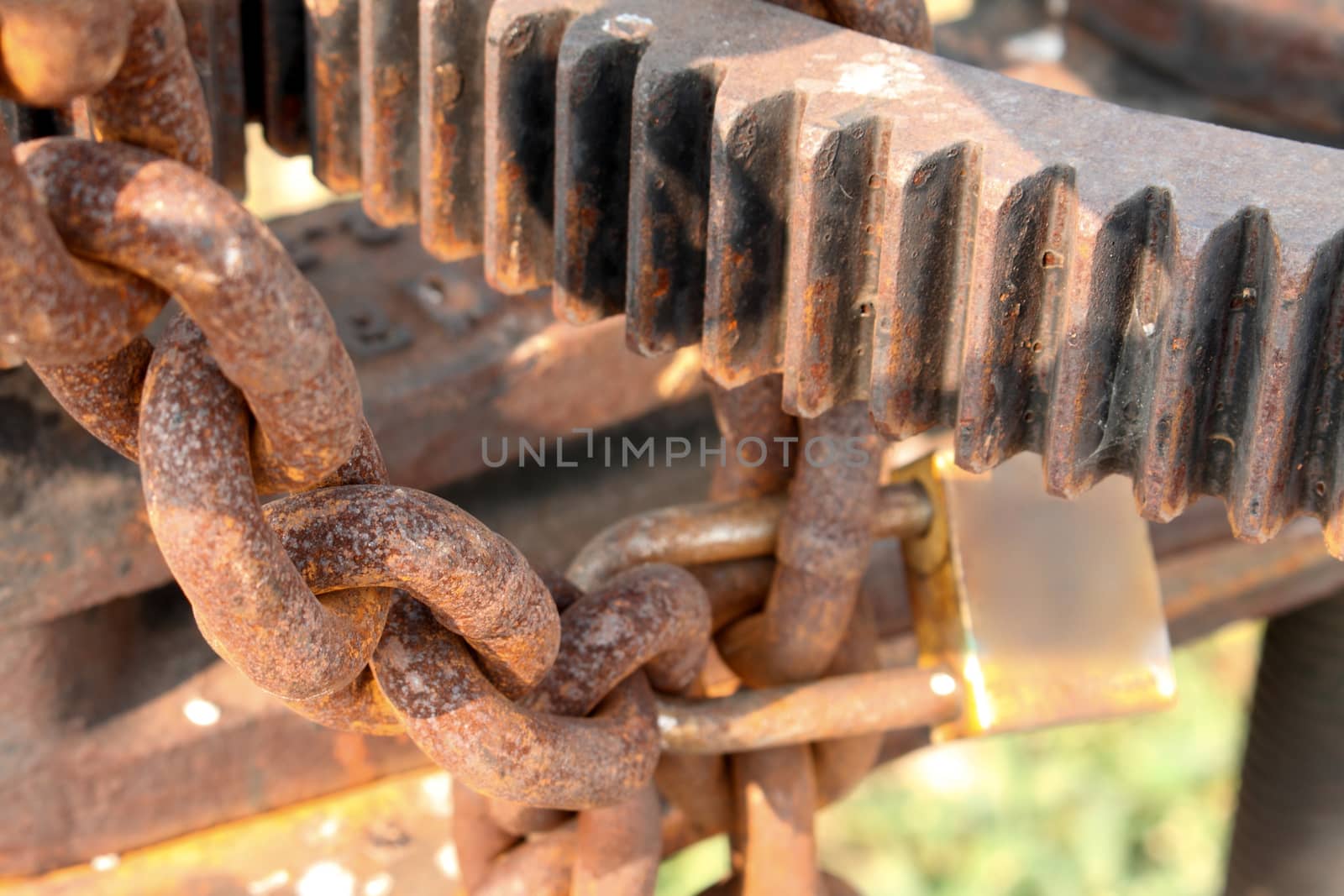 Rusty chains and sprockets background by worrayuth