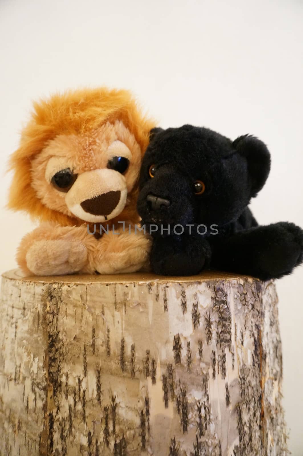 Soft toys, a lion and a panter