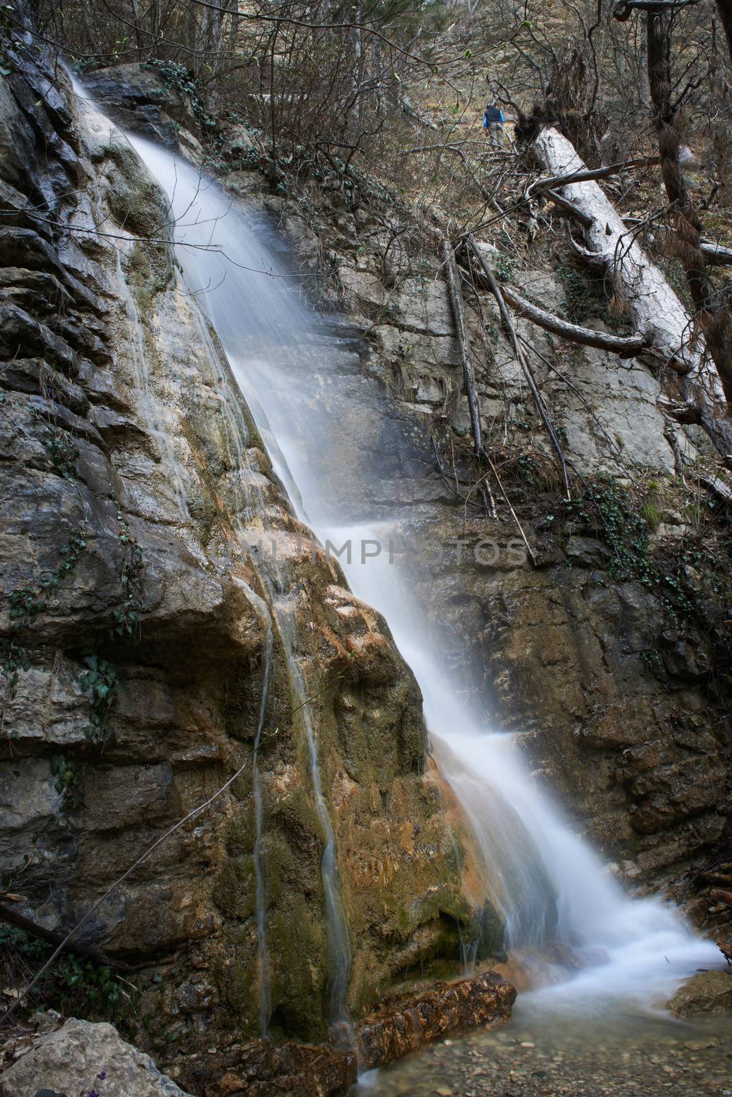 Beautiful waterfall in the forest. Water motion.