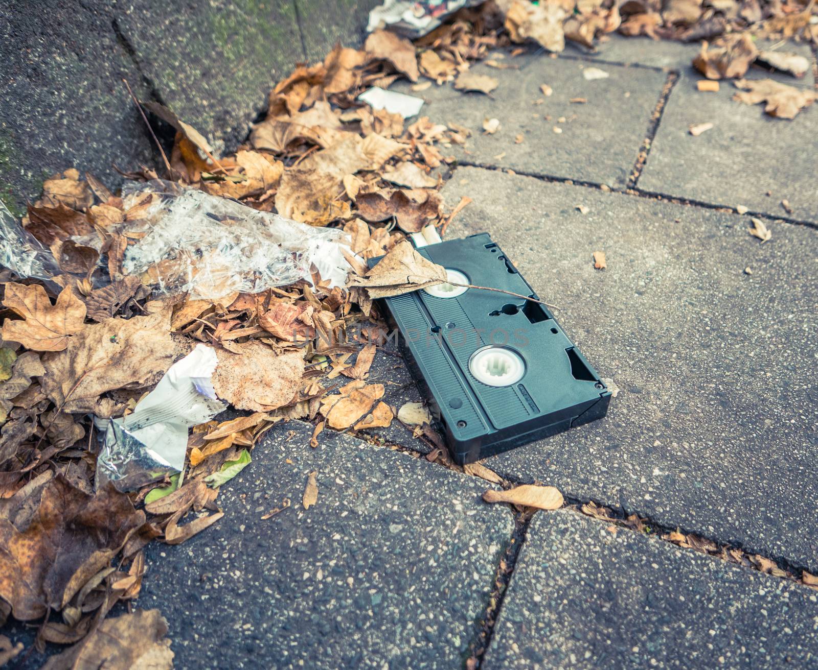 Conceptual Image Of An Abandoned VHS Tape In The Street