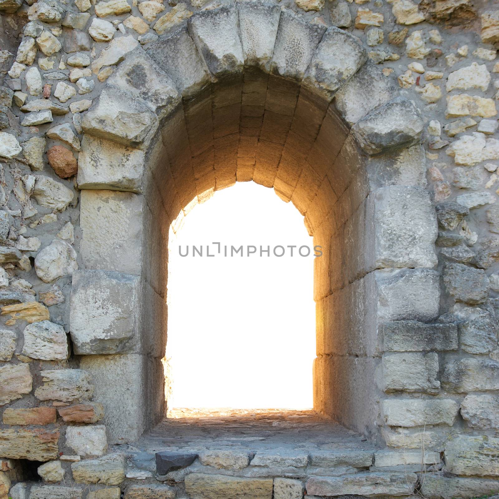 Exit in the ancient wall. Entrance to nowhere isolated on white background