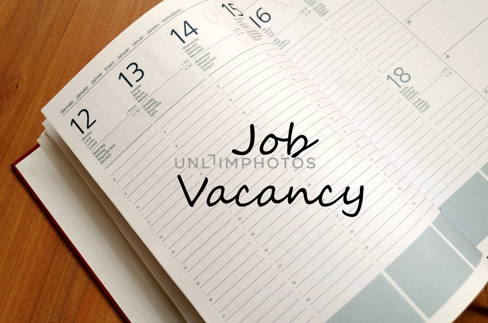 Job vacancy text concept write on notebook with pen