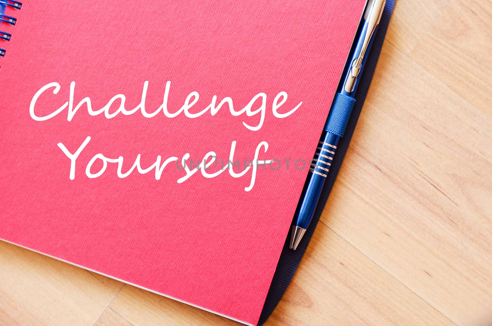 Challenge yourself text concept write on notebook with pen