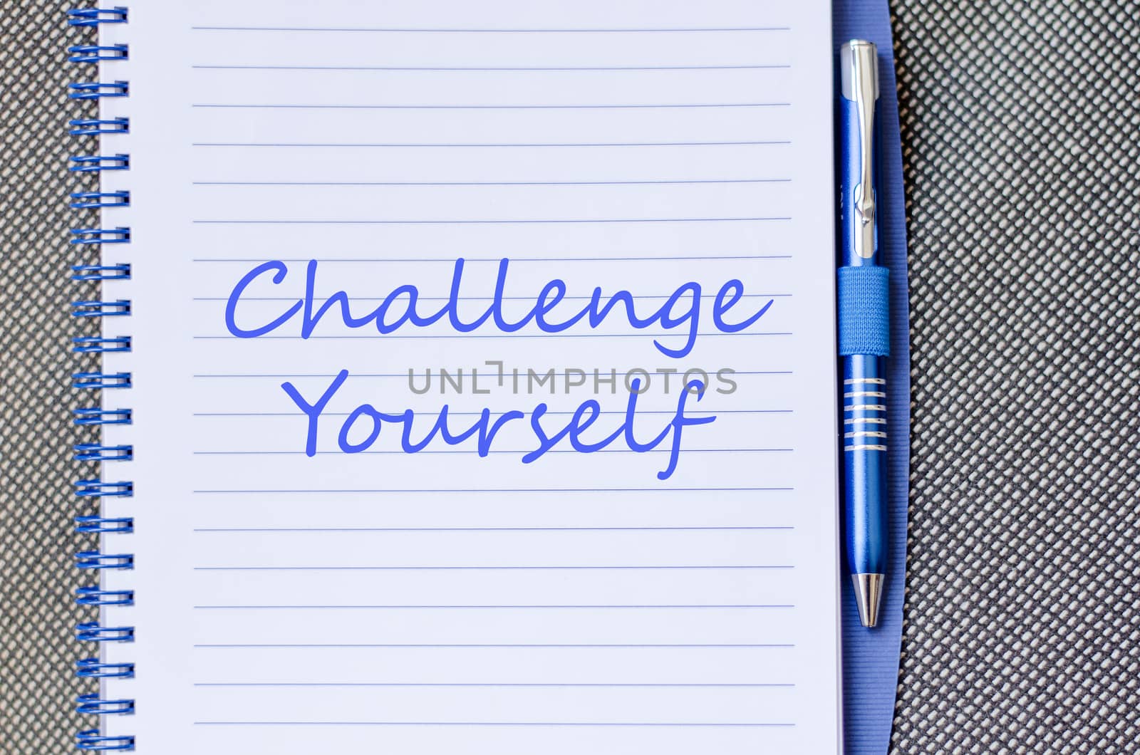 Challenge yourself text concept write on notebook with pen