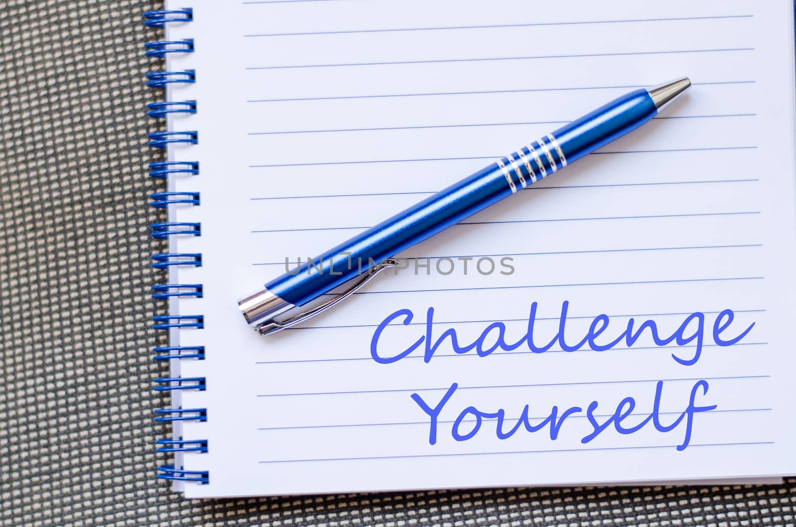 Challenge yourself text concept write on notebook with pen