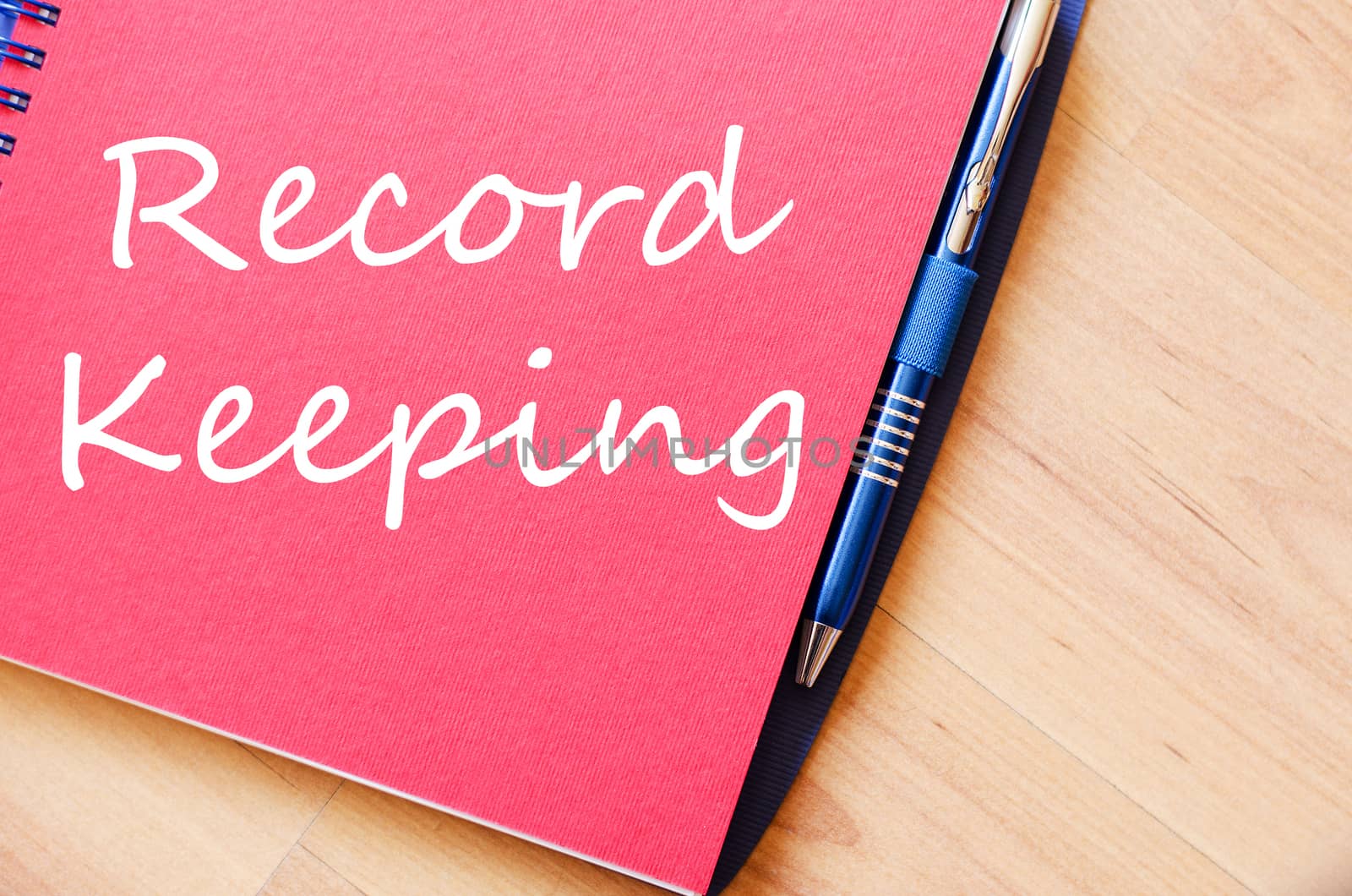 Record keeping text concept write on notebook with pen