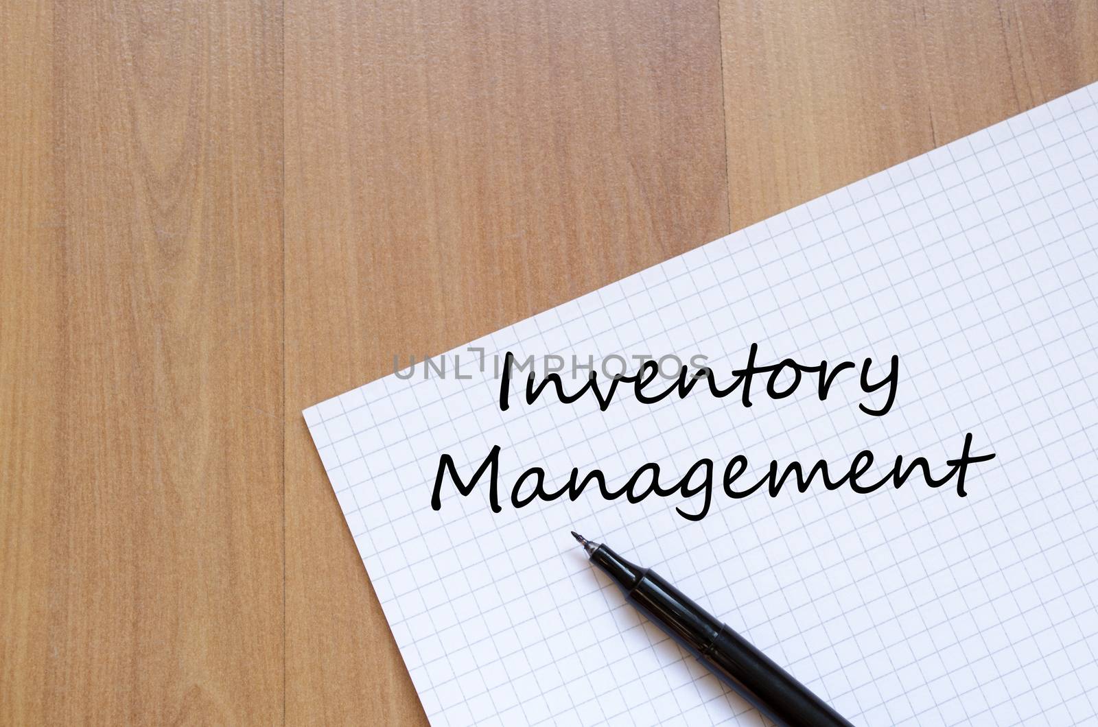 Inventory management text concept write on notebook with pen