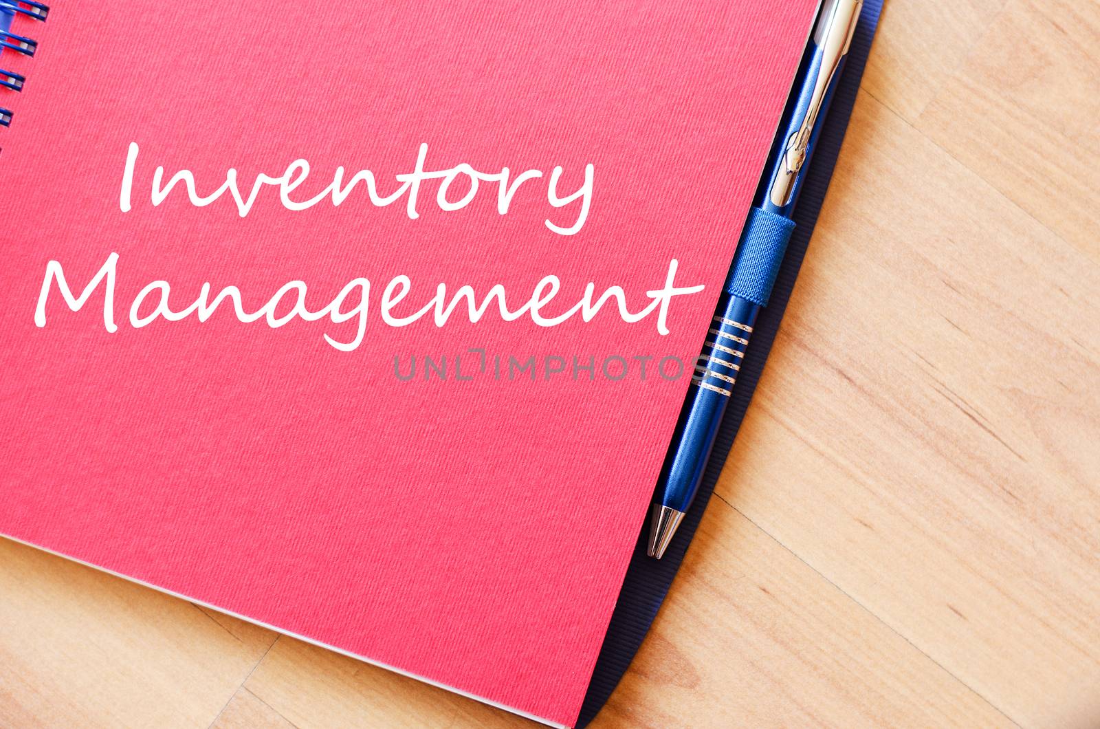 Inventory management text concept write on notebook with pen