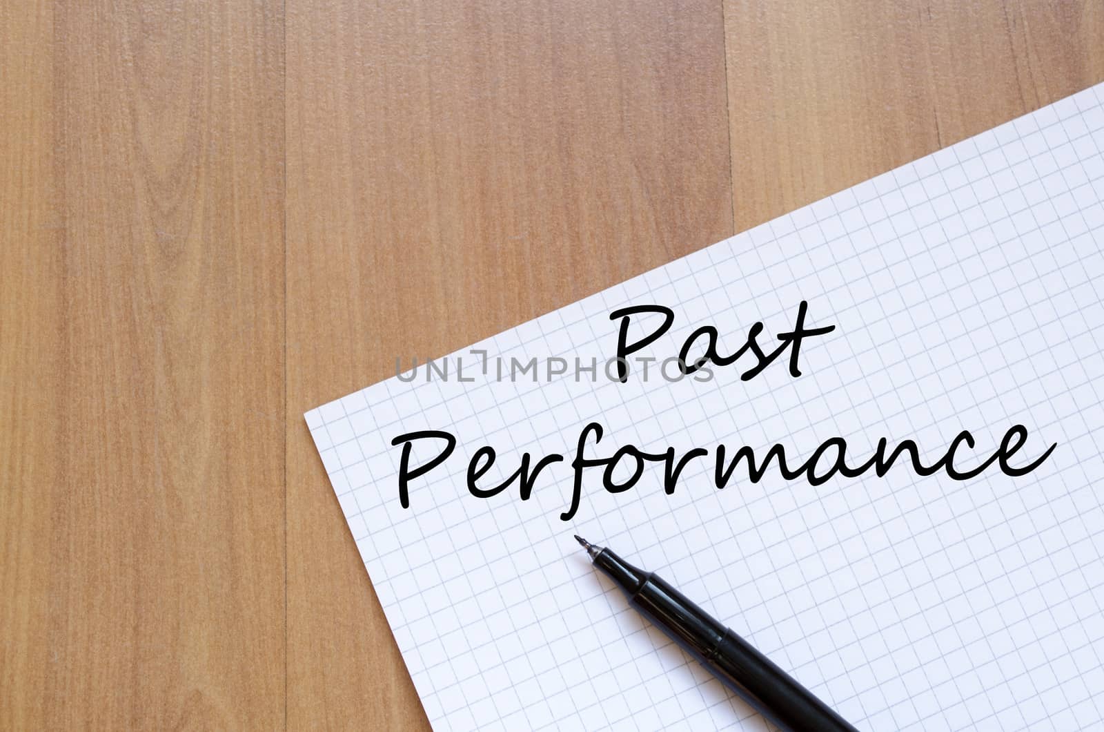 Past performance text concept write on notebook with pen