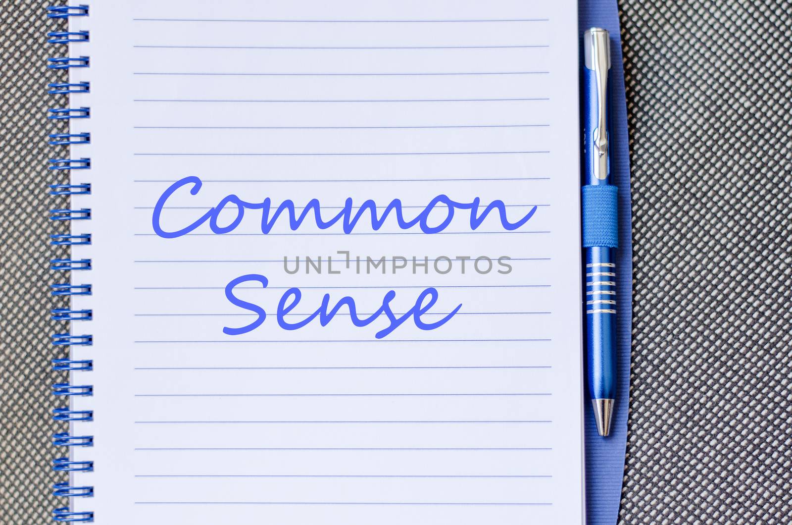 Common sense text concept write on notebook with pen