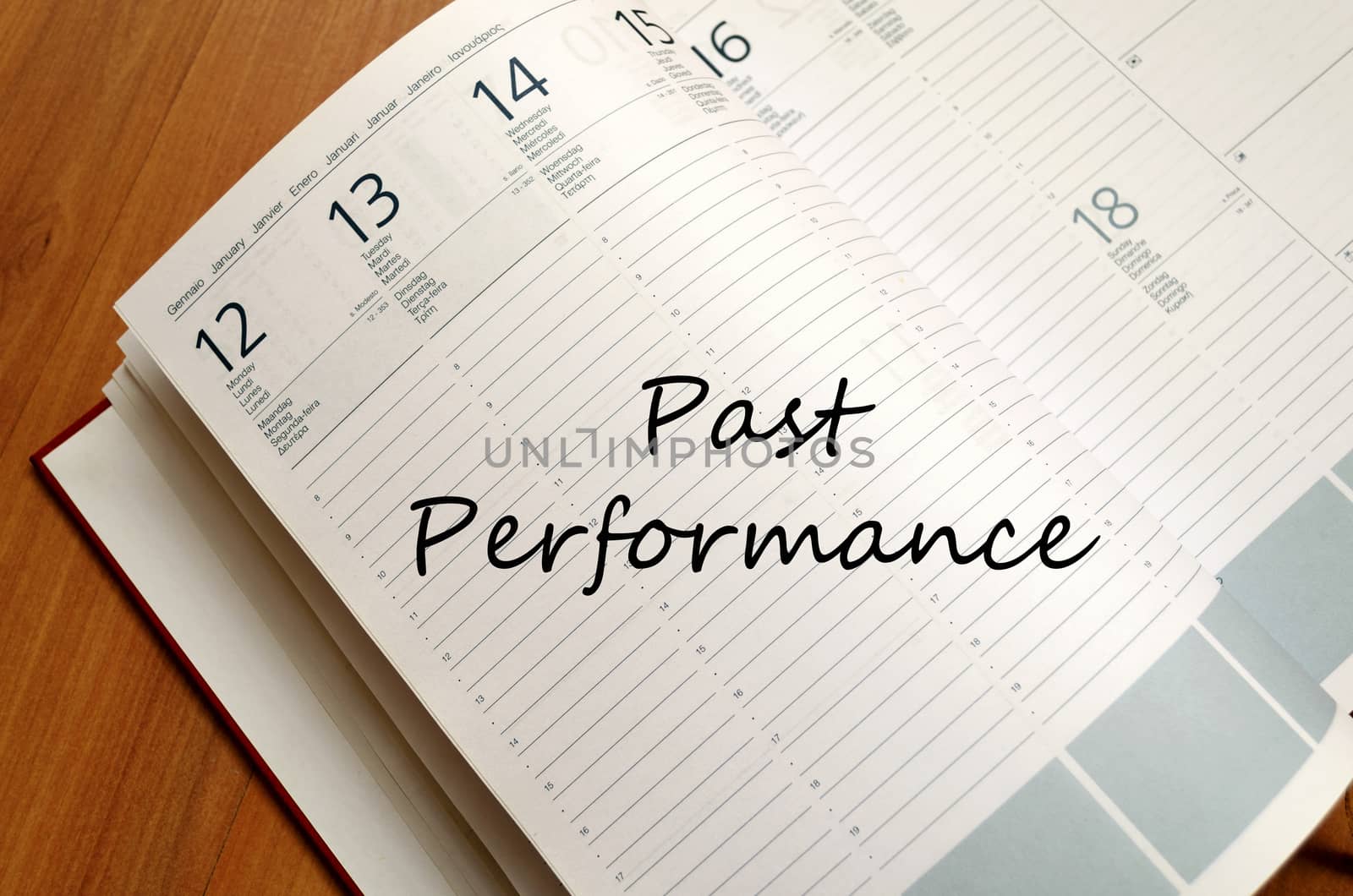 Past performance text concept write on notebook with pen