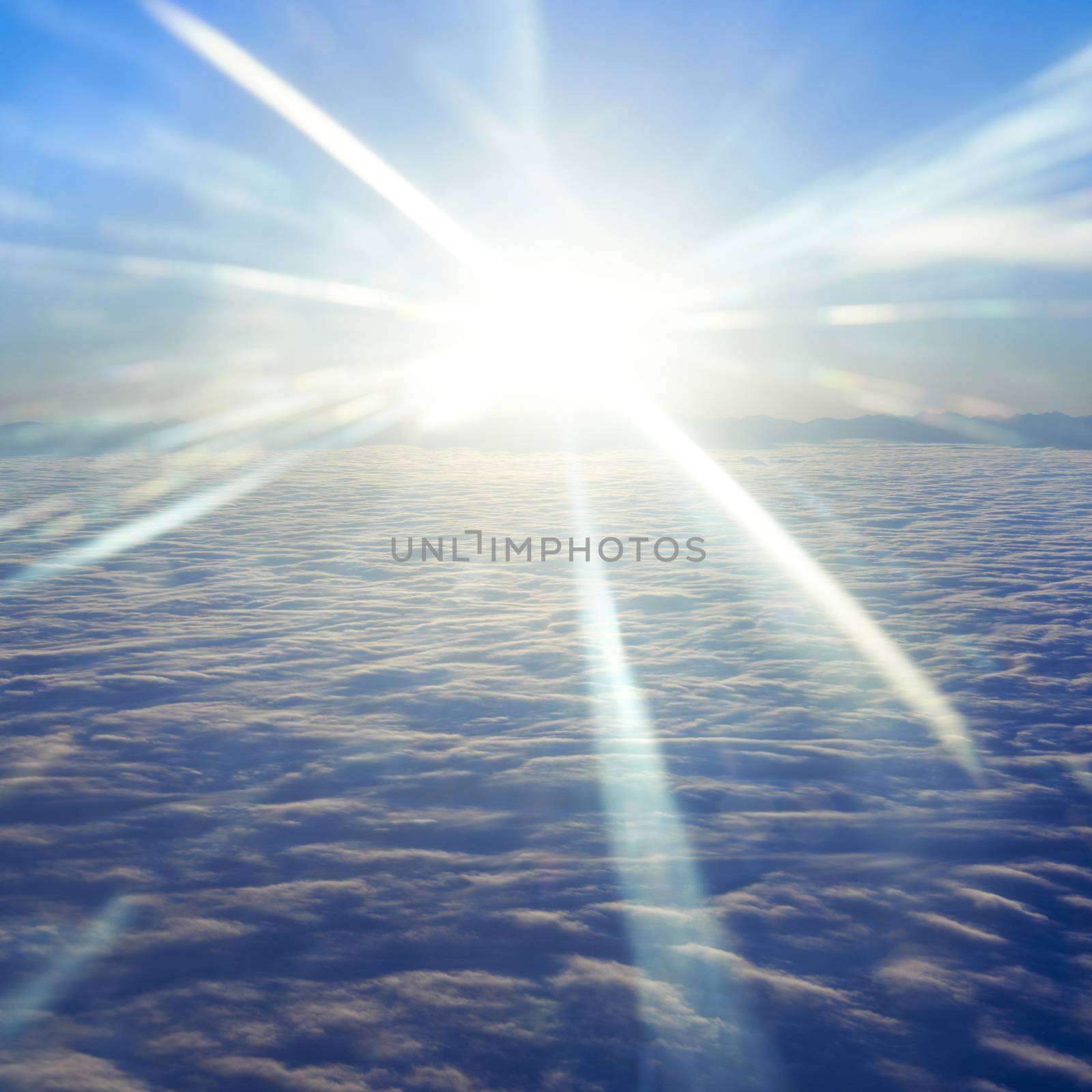 Amazing view from plane on the sky, sunset sun and clouds