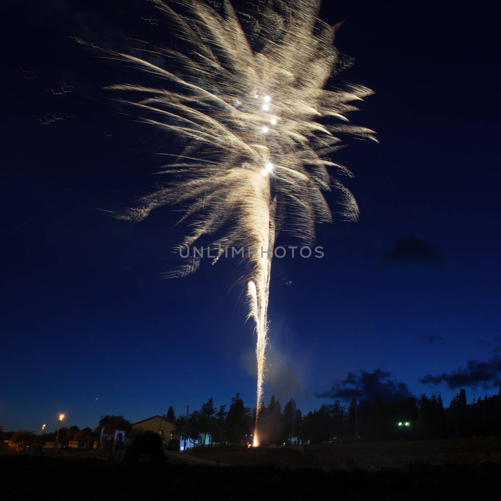 Blue colorful fireworks on night sky background