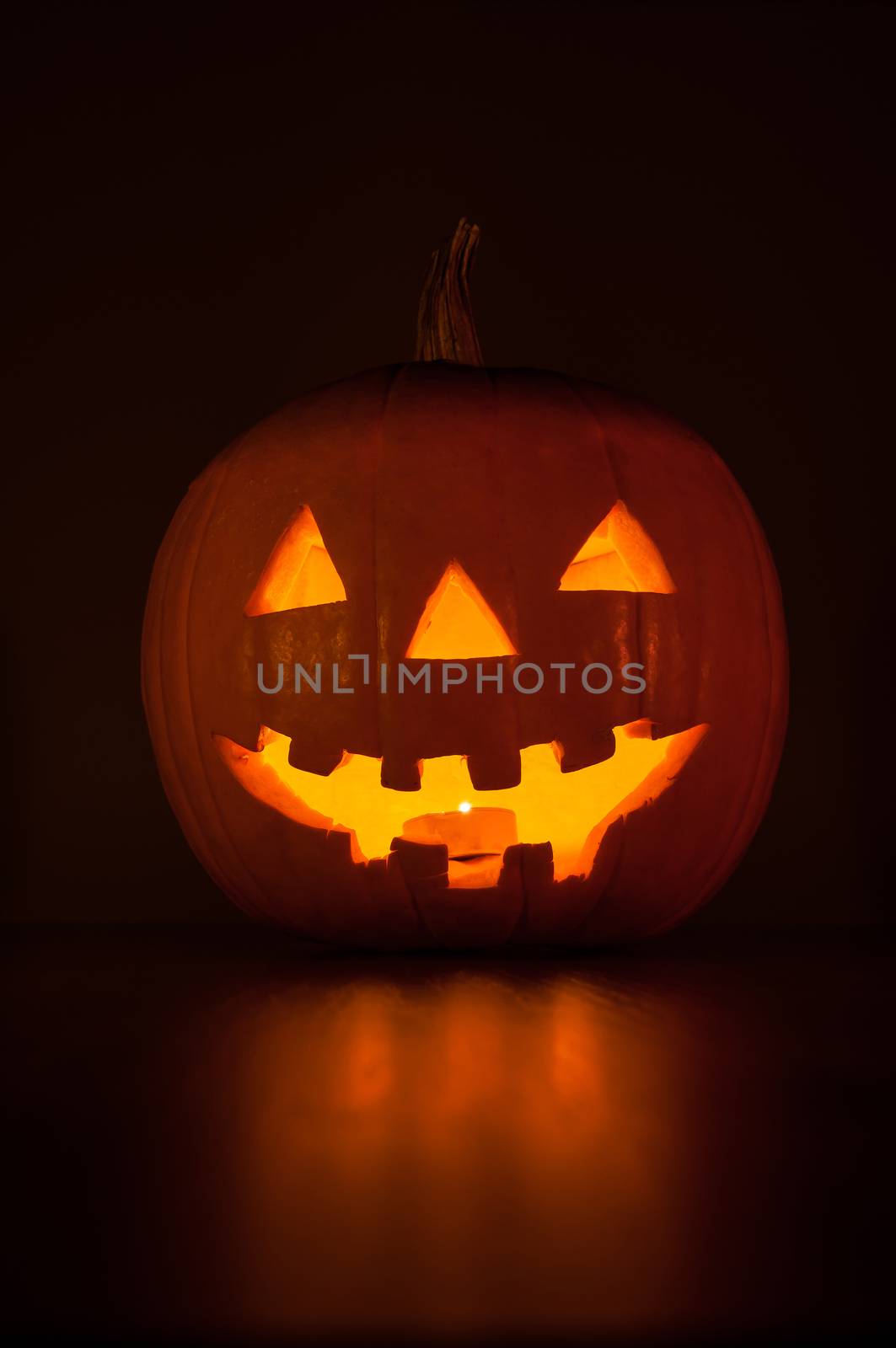 Funny halloween pumpkin glowing in the dark