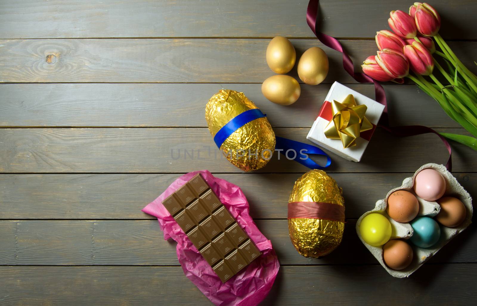 Easter eggs on wooden background by unikpix