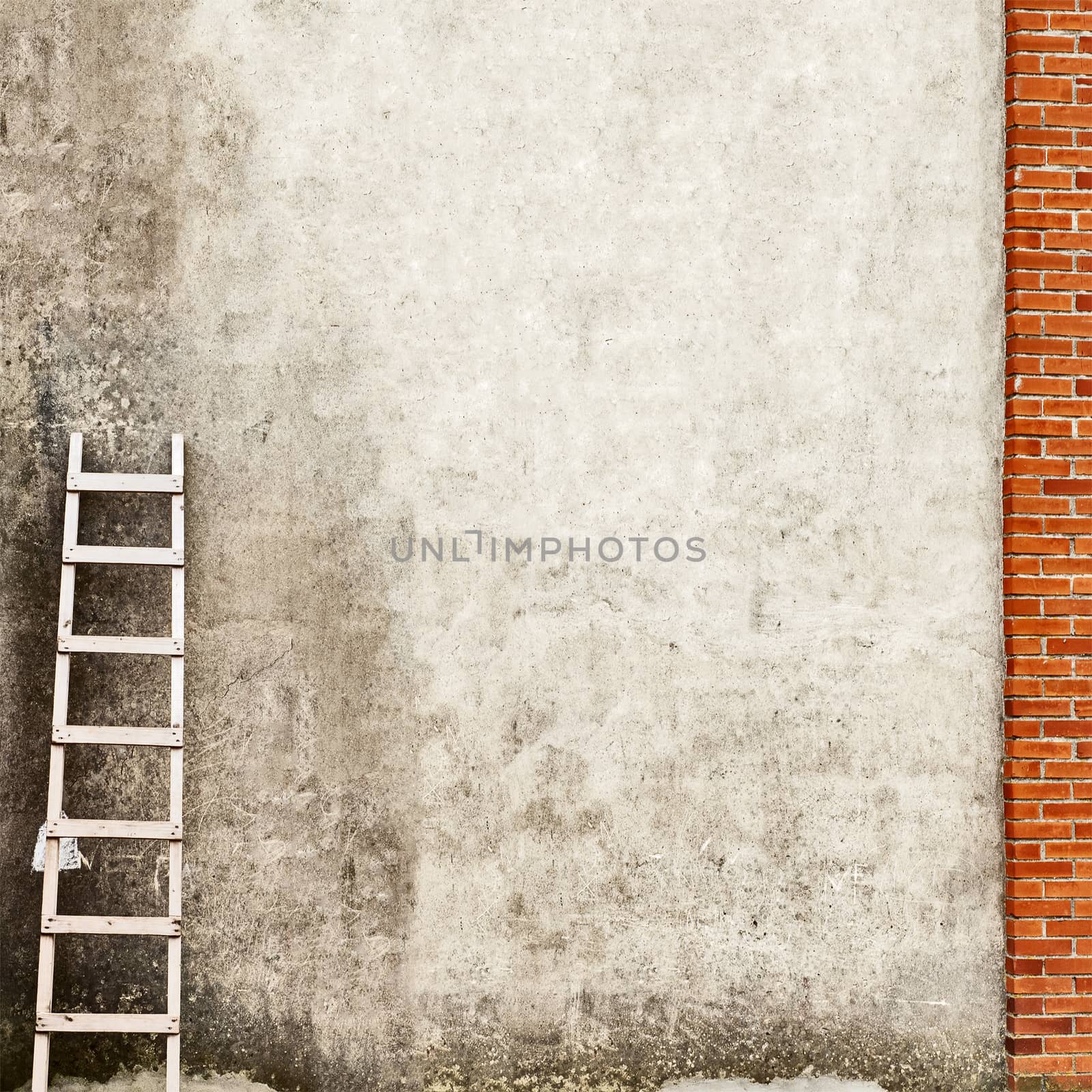 weathered stucco wall background, ladder near the wall