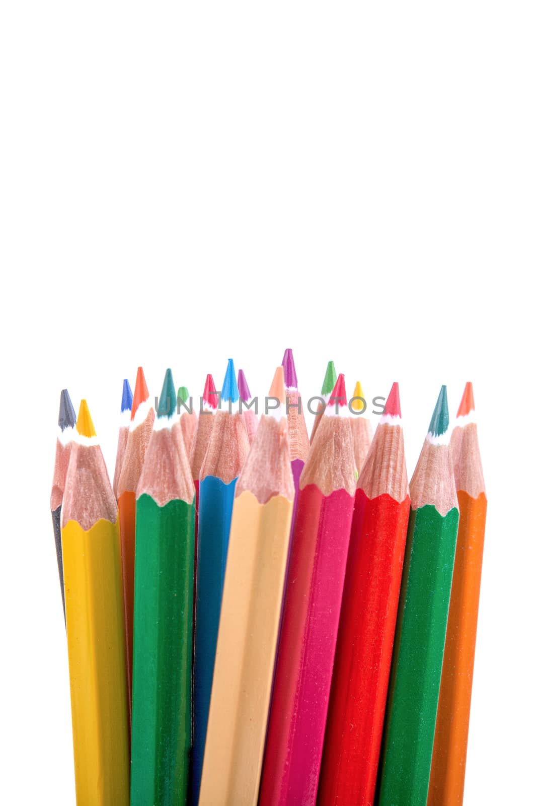 Colored pencils on the white background