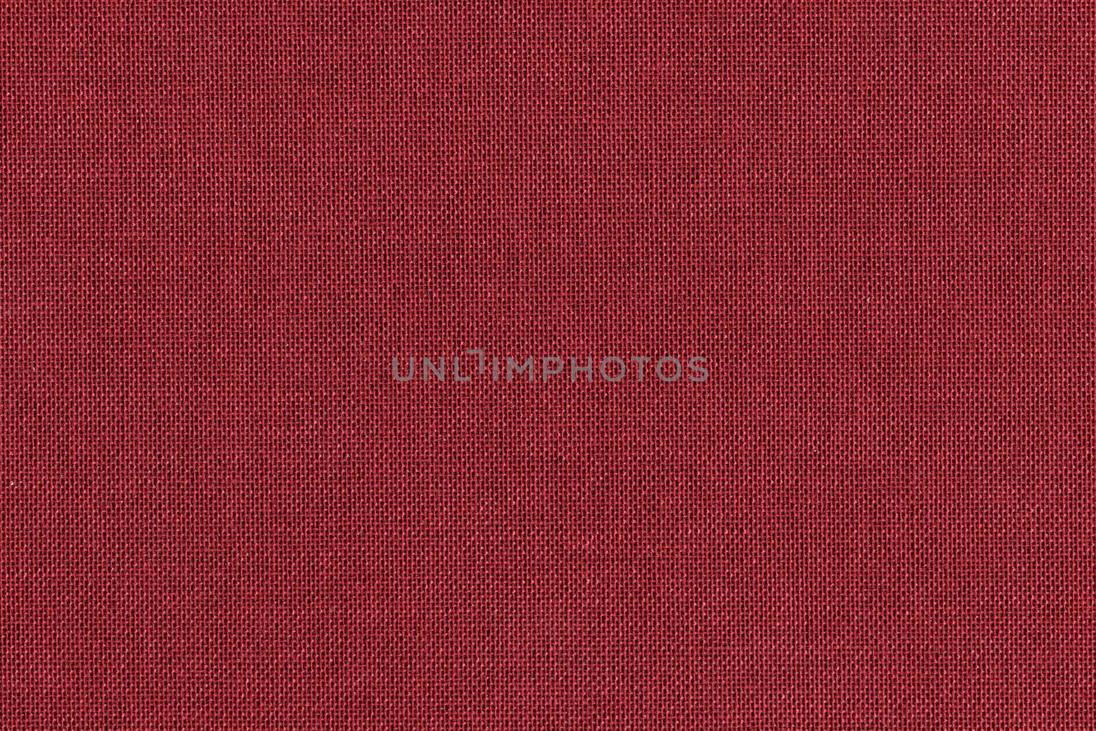 Dark red knitted fabric texture closeup, useful as background