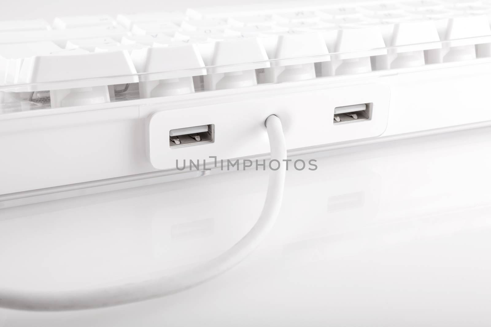 White computer keyboard with usb port on white background