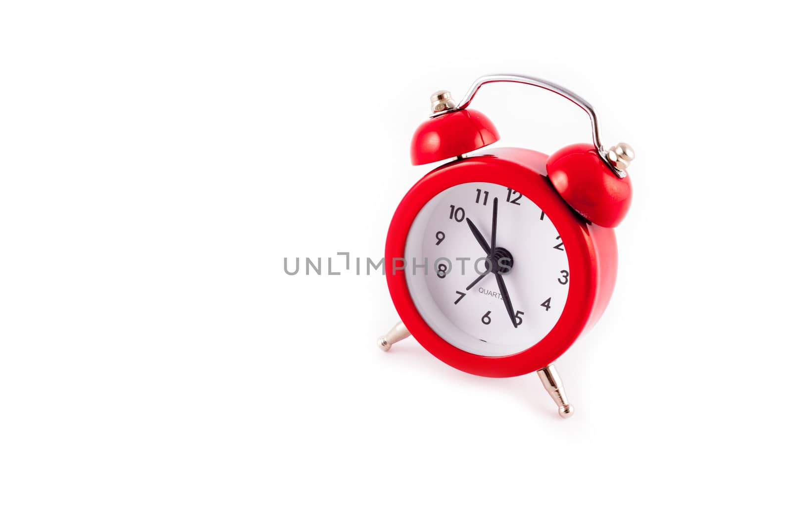 Alarm Clock. Classic red old style alarm clock isolated on white