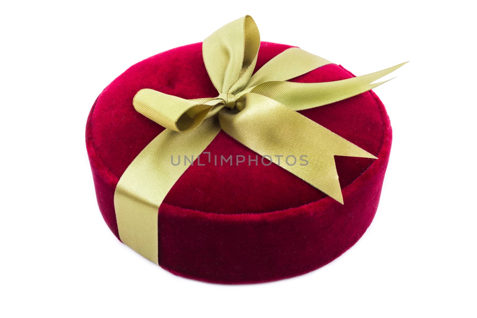 Luxury gift box in dark red shades with green satin ribbon and bow isolated over white background.