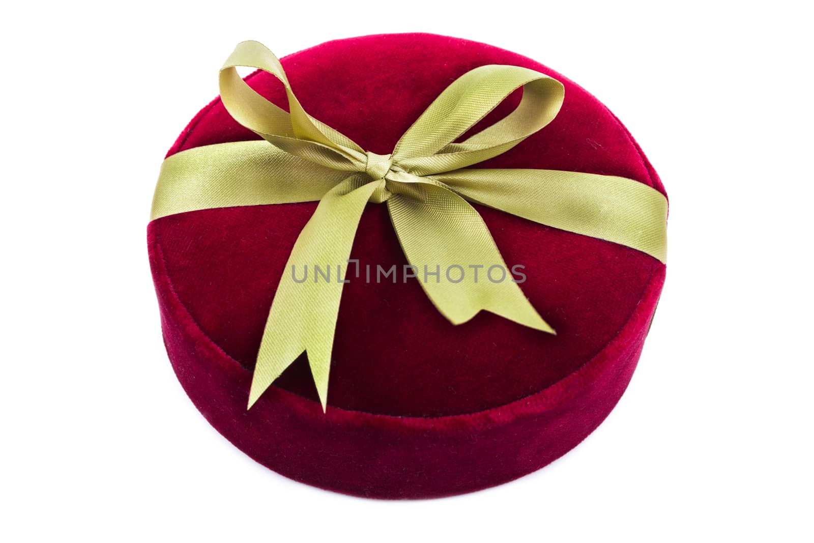 Luxury gift box in dark red shades with green satin ribbon and bow isolated over white background.
