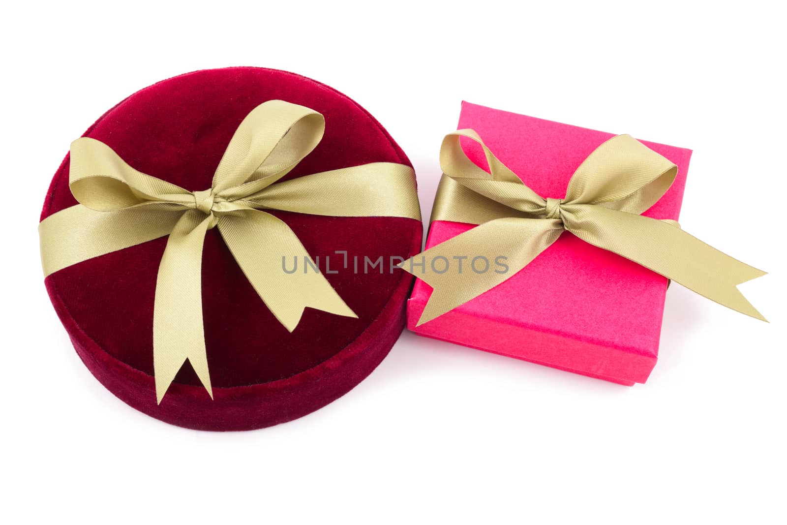 Luxury gift boxes with satin ribbon and bow isolated over white background.