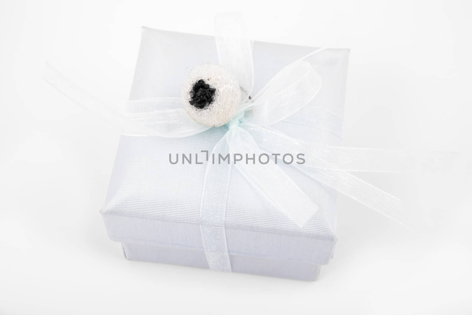 Simple gift box in light blue shades isolated over white background.