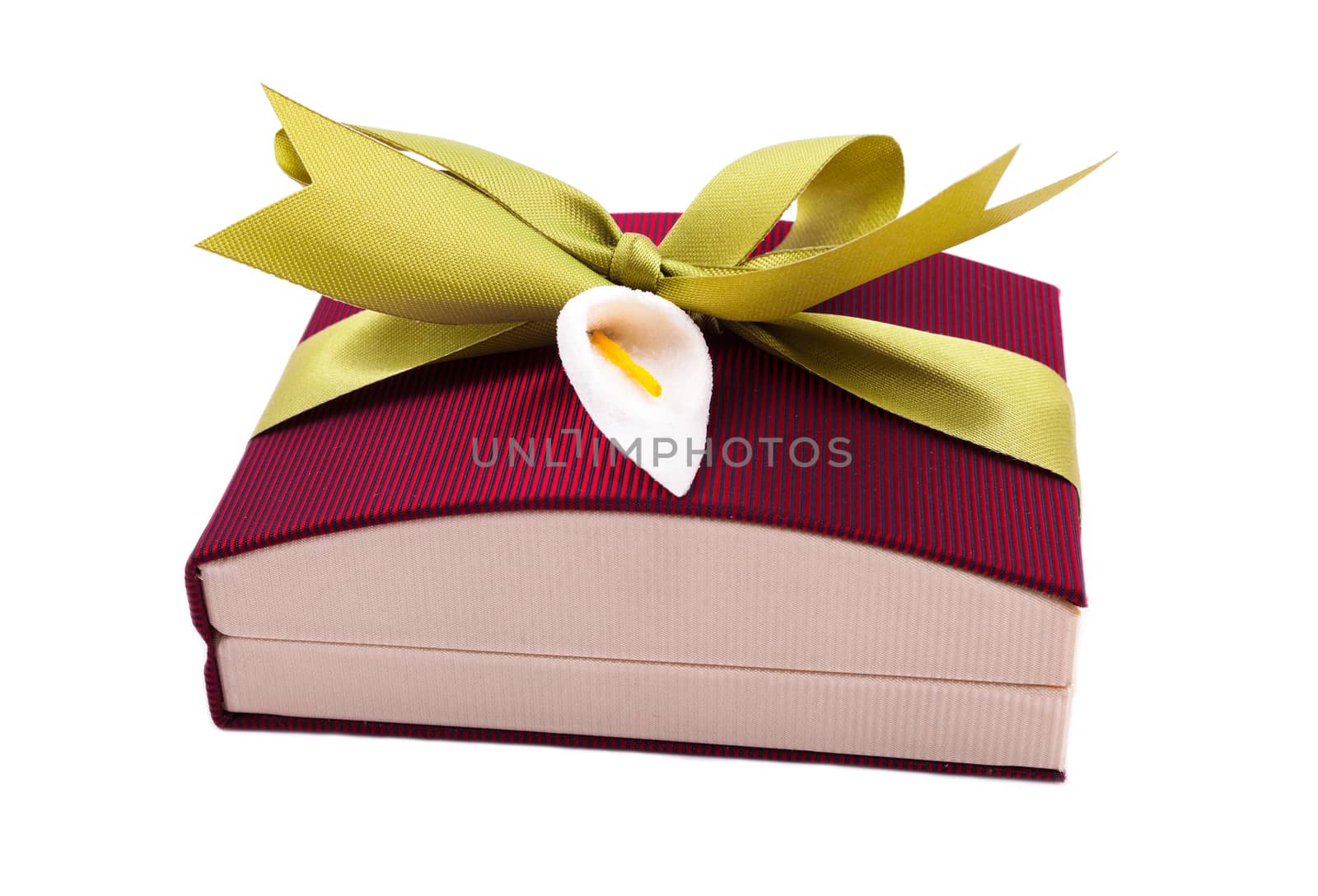 Dark red gift box with a green bow on white background by Portokalis