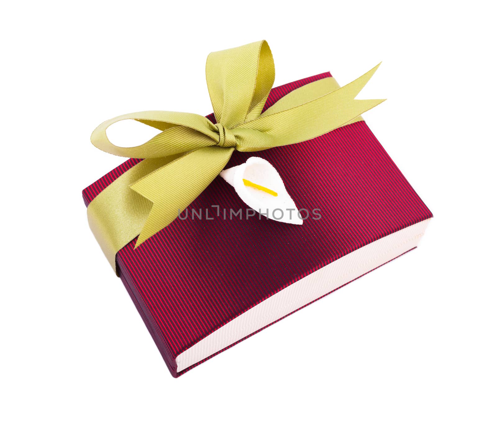 Luxury gift box in dark red shades with green satin ribbon and bow isolated over white background.