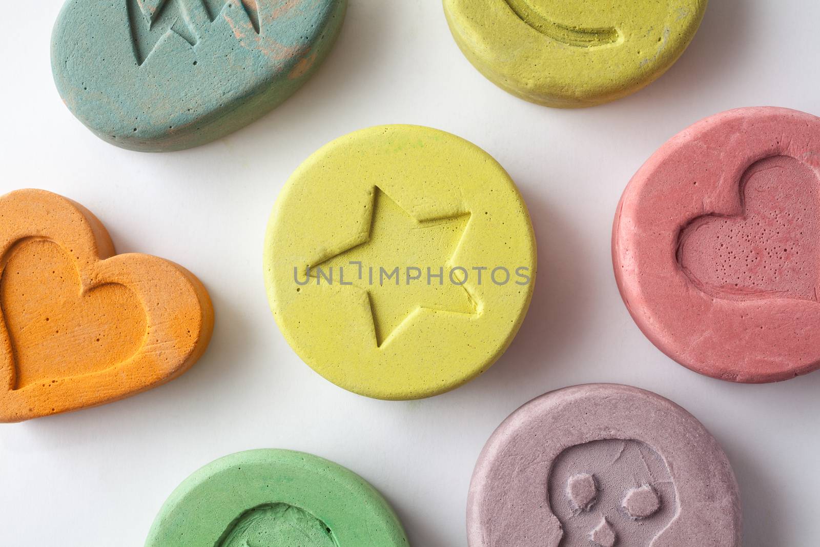 Ecstasy tablets on white background