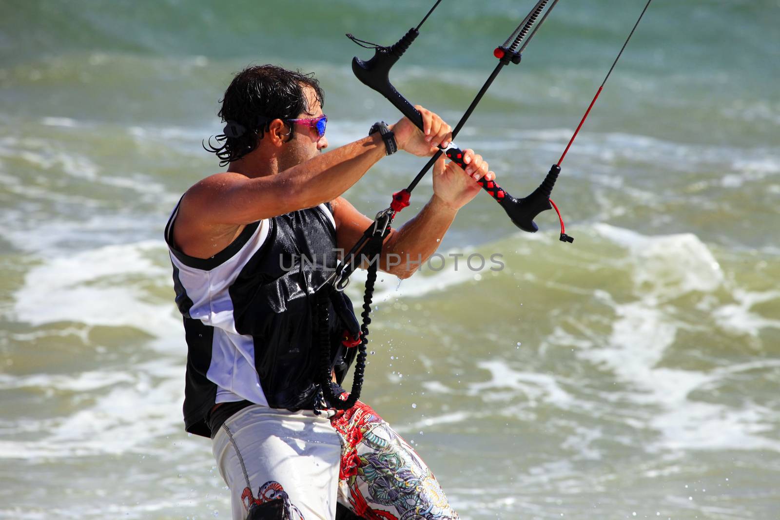 Kiteboarder enjoy surfing in ocean. Vietnam