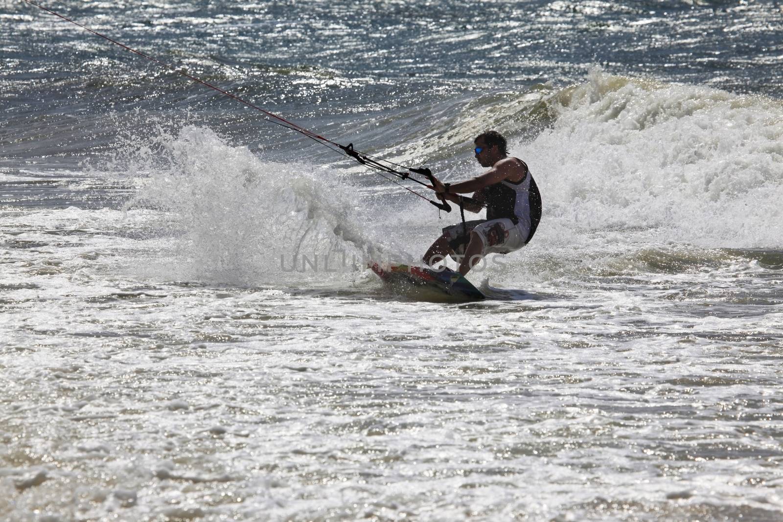Kiteboarder enjoy surfing in ocean. Vietnam