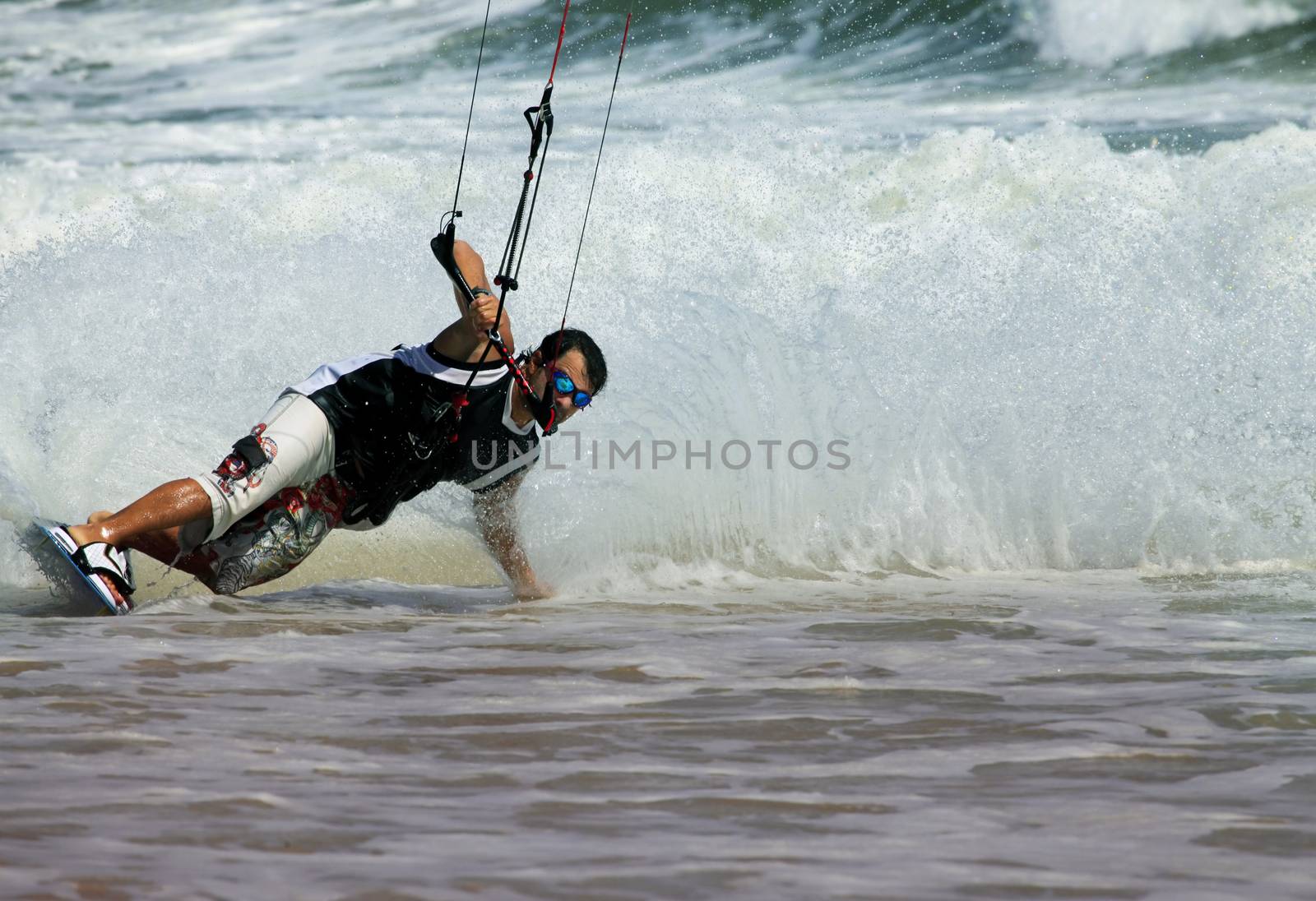 Kiteboarder enjoy surfing in ocean. Vietnam