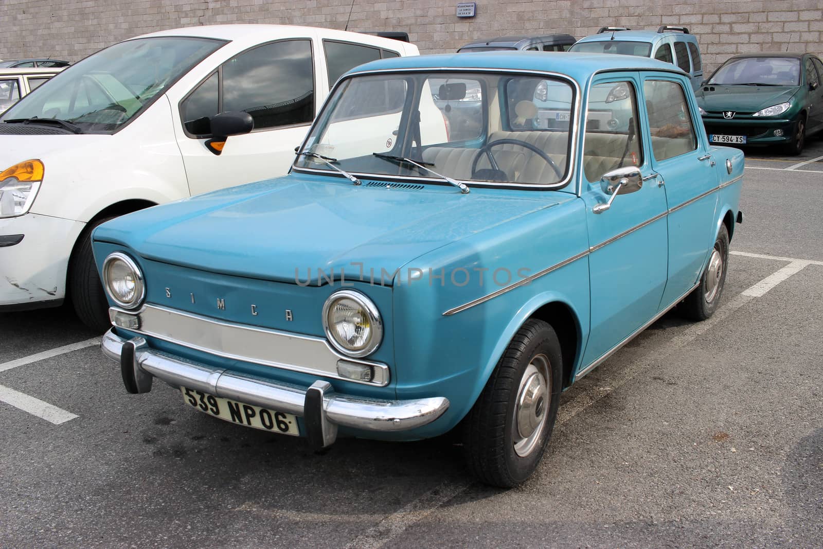 Menton, France - February 26, 2016: Vintage Blue Car Simca 1000 Parked in a Parking Lot of Menton Harbor. South of France