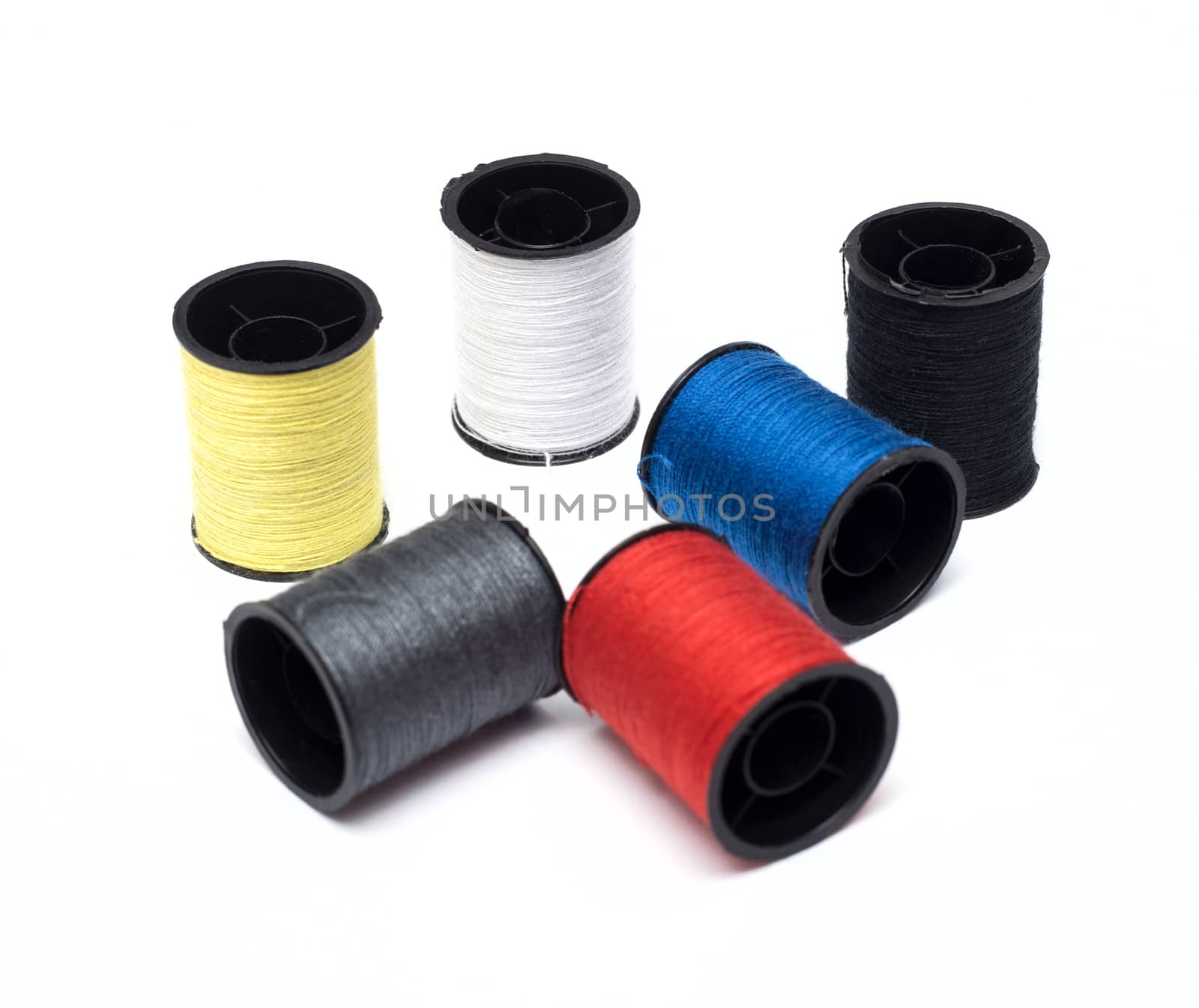 set of color threads on a white background