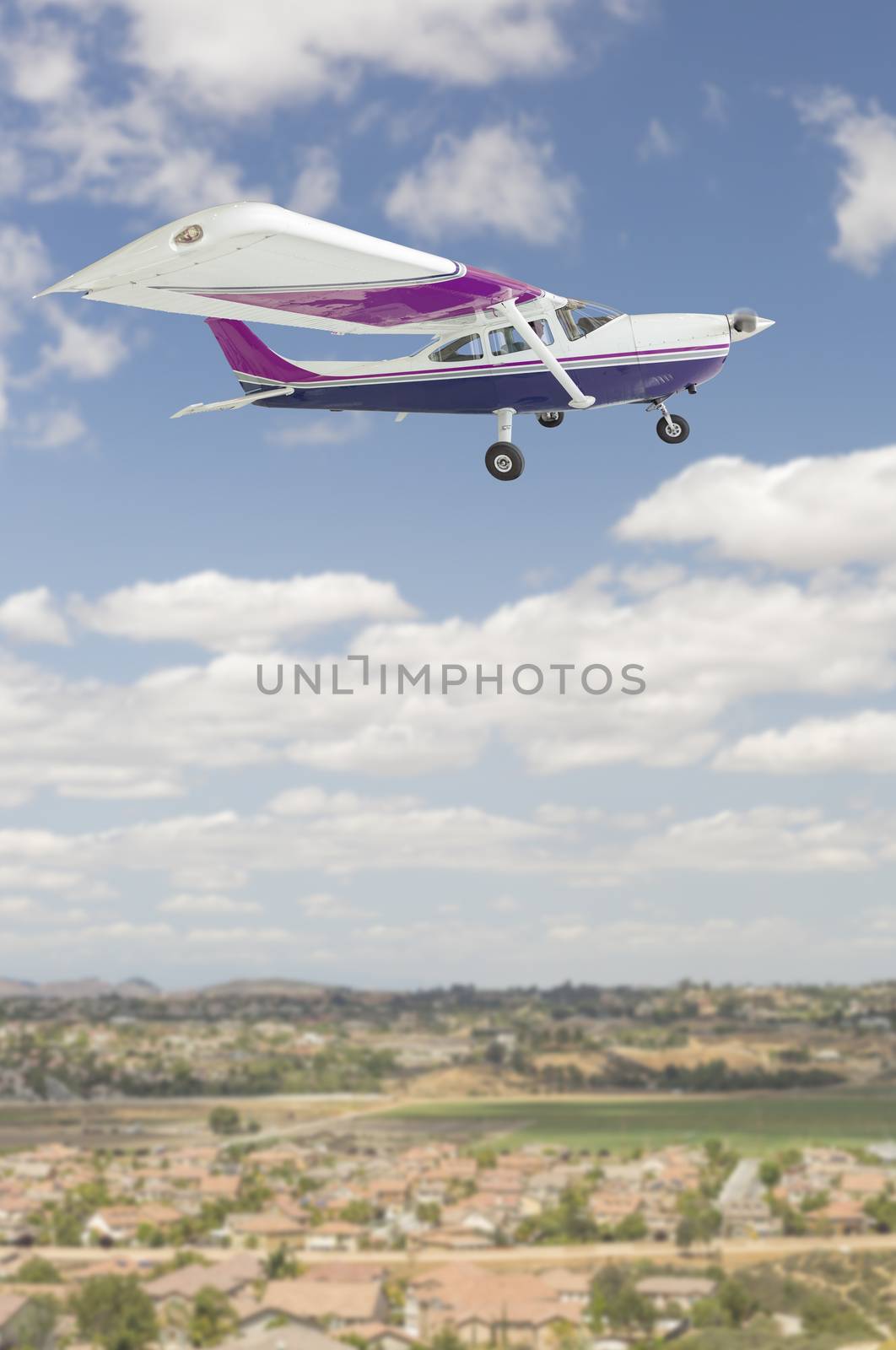 The Cessna 172 Single Propeller Airplane Flying In The Sky.