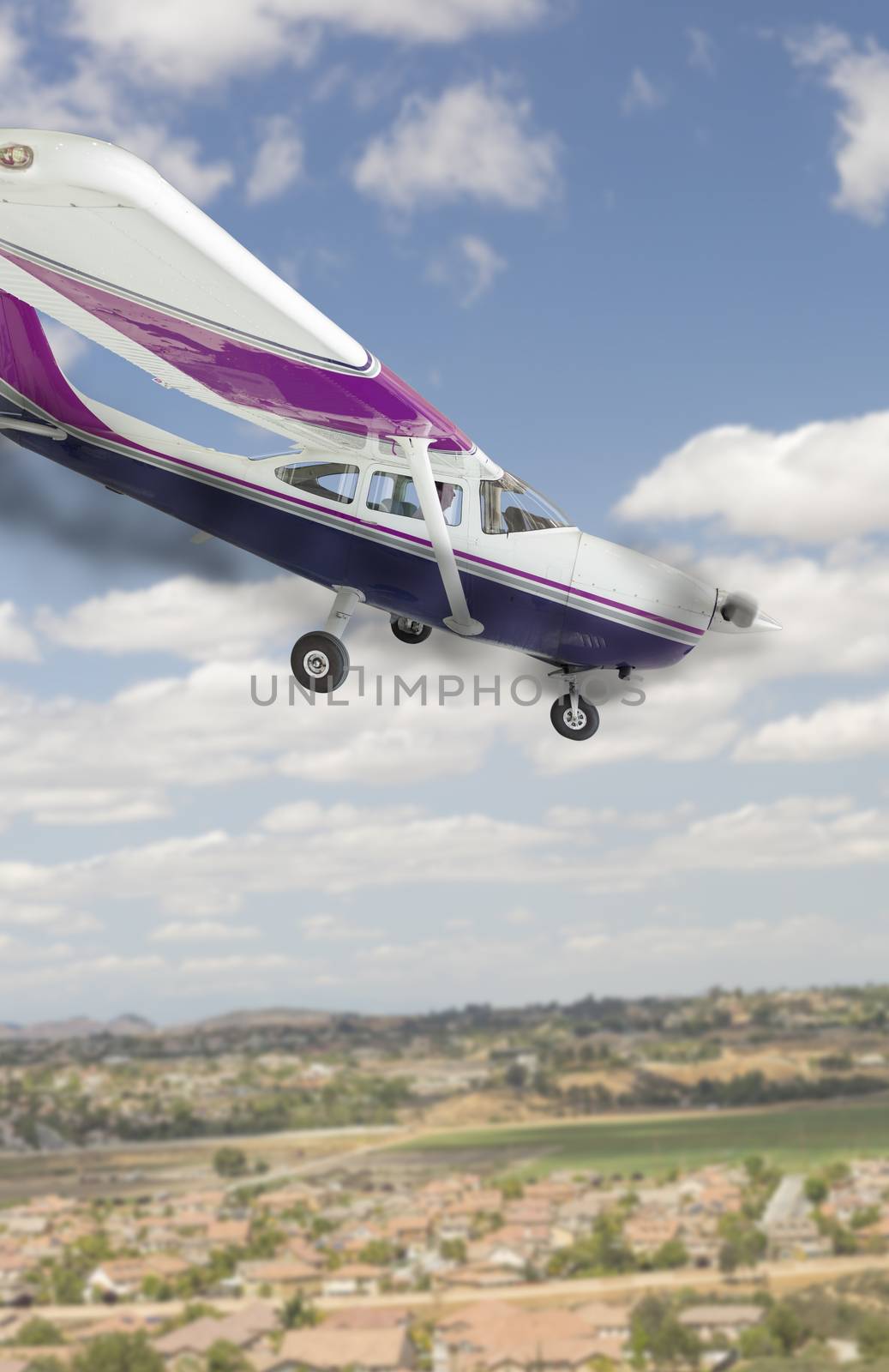 The Cessna 172 With Smoke Coming From The Engine Heading Down.