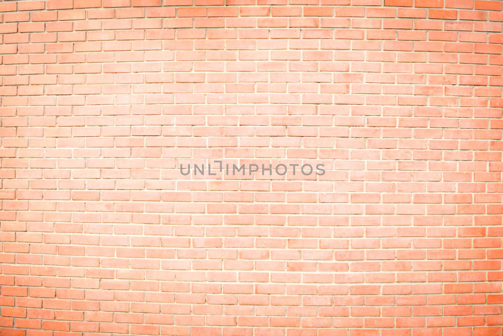brown brick wall is painted white in the middle for texture background