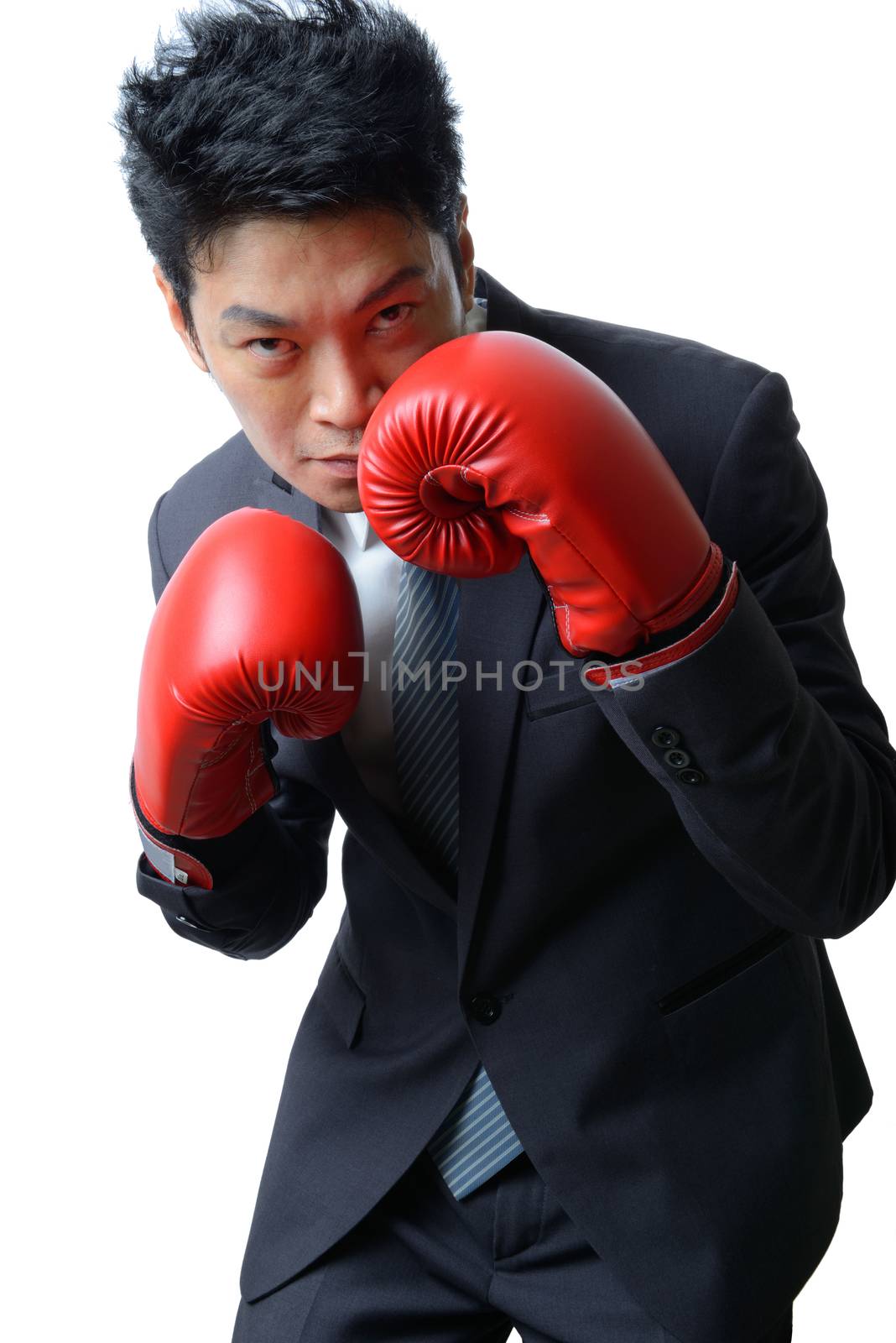 businessman with red boxing glove ready to fight with work, business concept