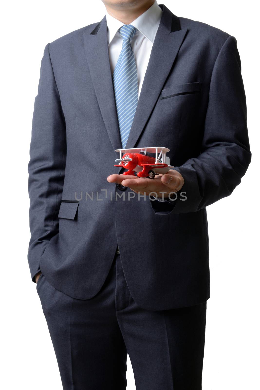 Businessman gives the model airplane to the customer isolated on white background, airline business concept