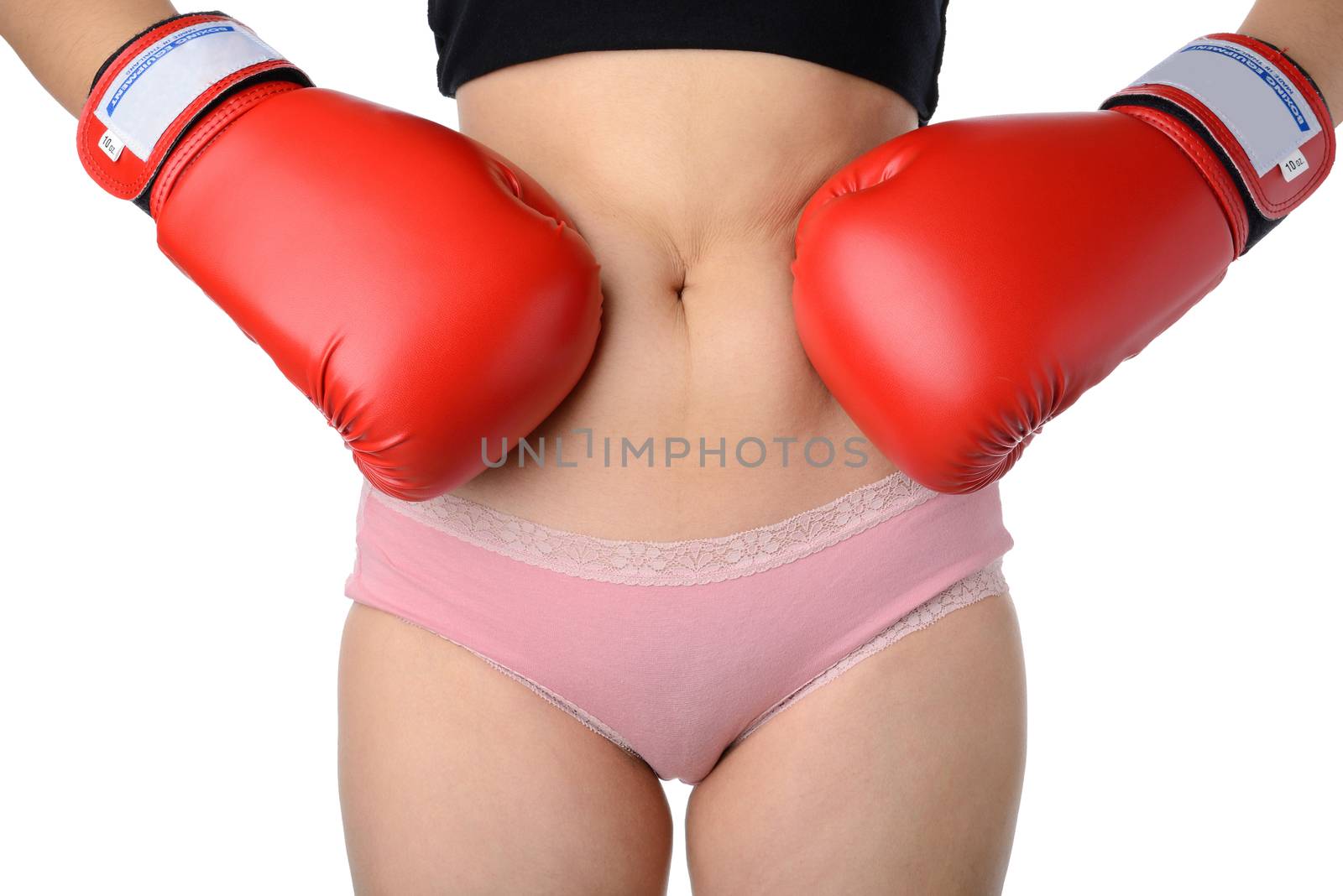 woman with the boxing gloves fight with her belly, Diet concept by numskyman