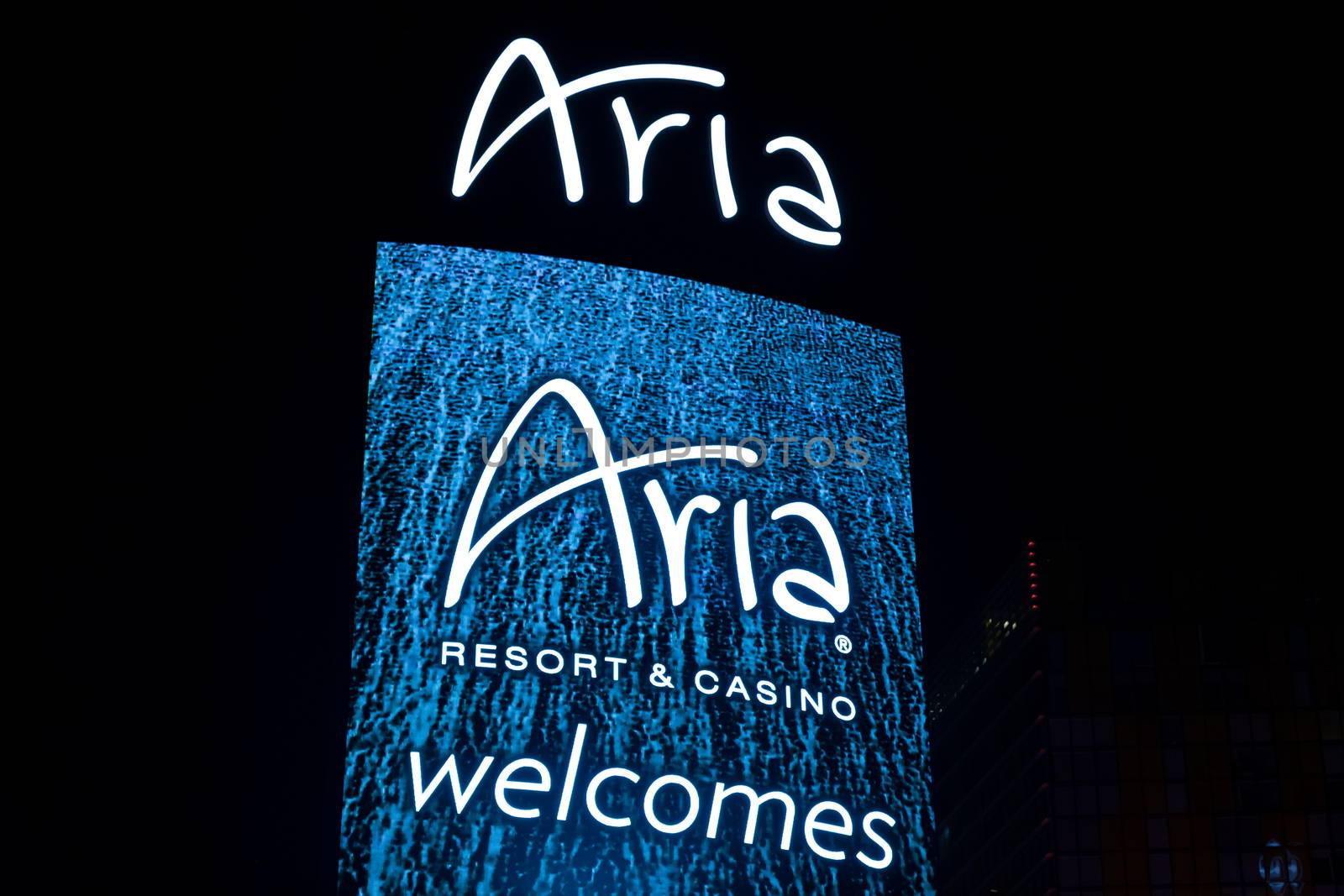 LAS VEGAS, NV/USA - FEBRUARY 14, 2016: The Aria hotel and casino exterior sign at night. Aria Resort and Casino is a luxury resort and casino on the Las Vegas Strip.