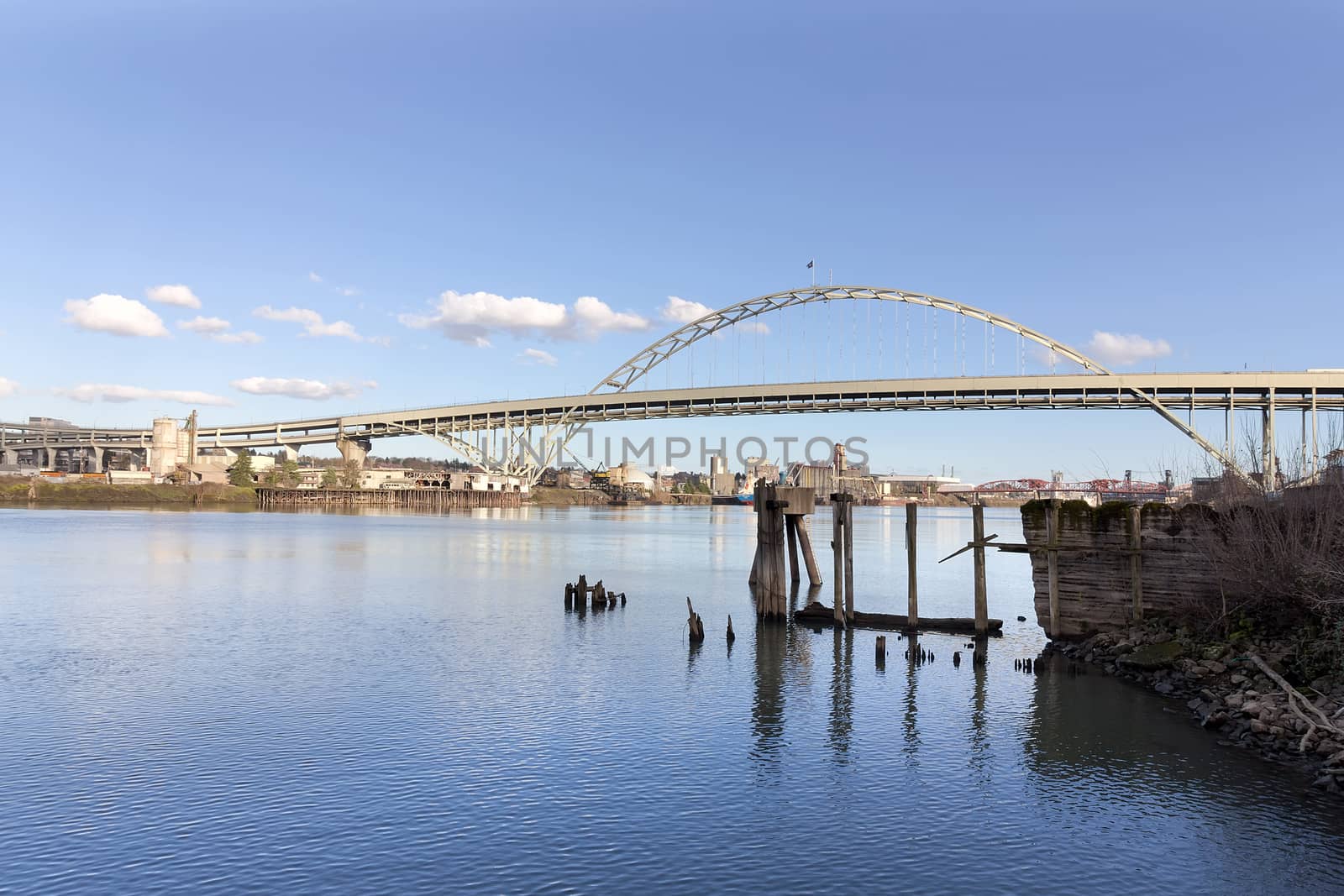 Fremont Bridge against blue sky along Willamette River in Portland Oregon