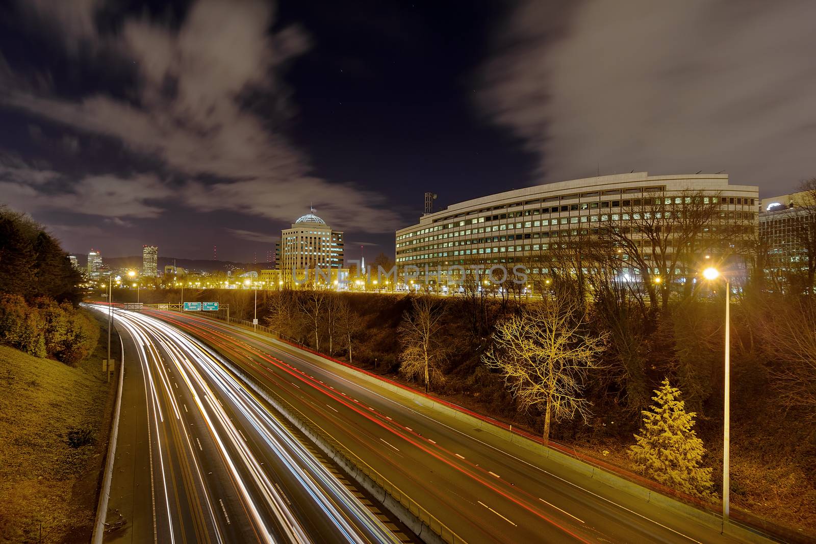Portland Oregon Cityscape by Interstate Freeway I-84 at Night with traffic light trails