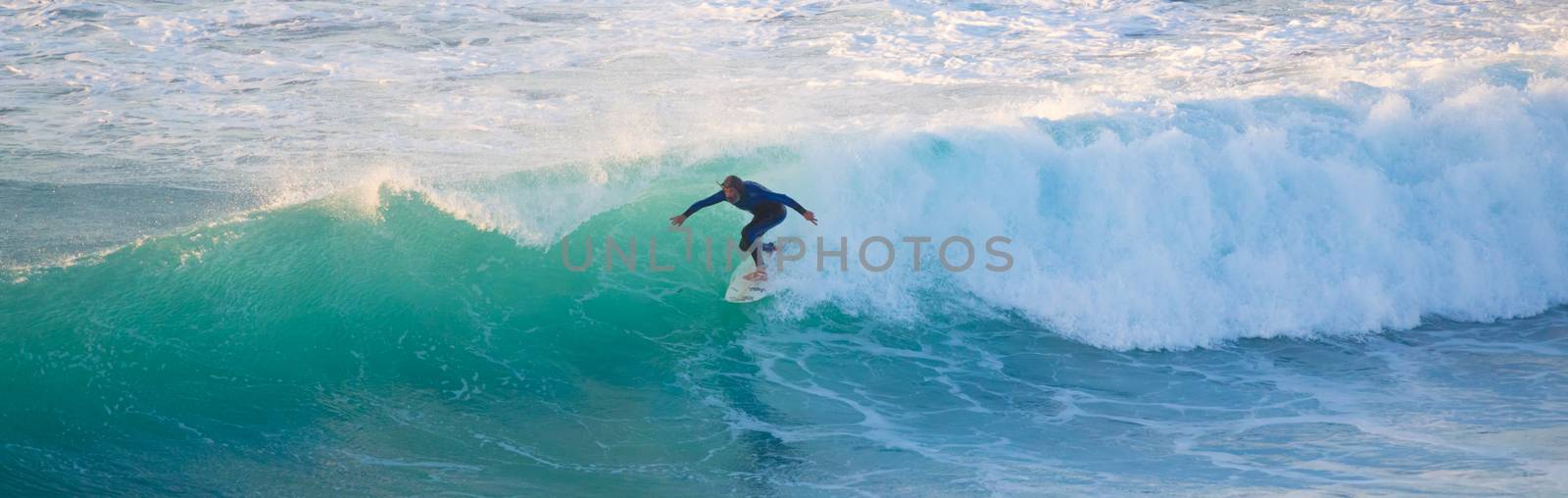 Senior surfer riding a perfect wave. by kasto