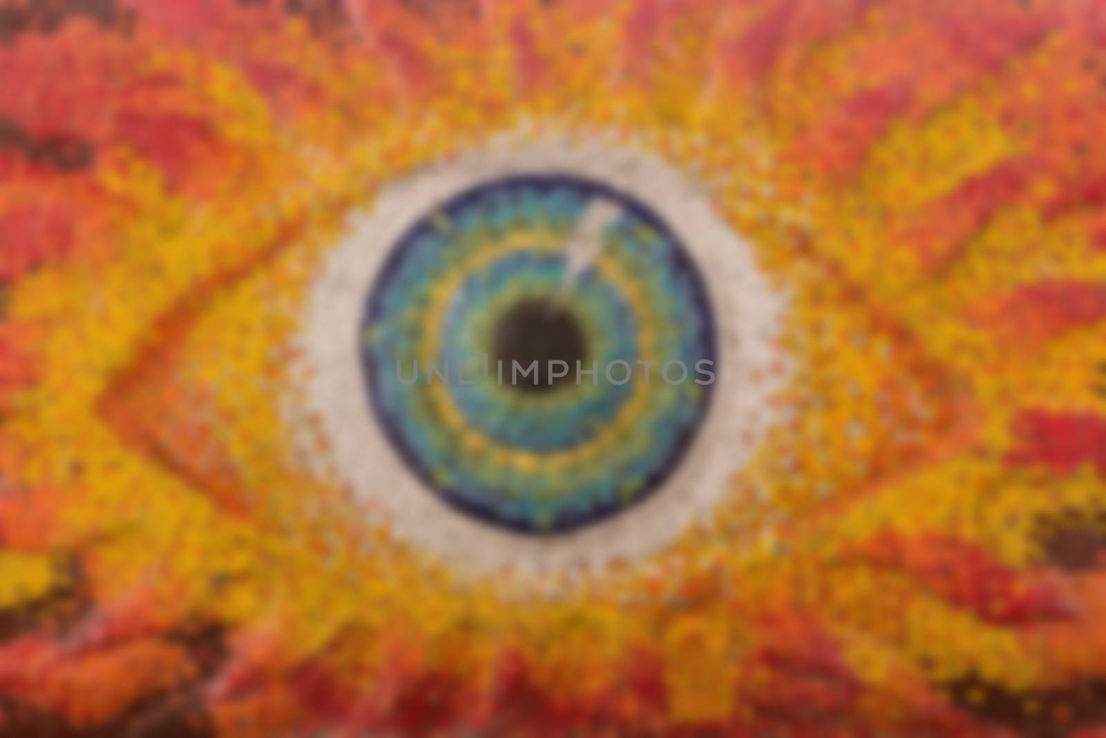 Colorful glass mosaic art shape eyes of god, blurred for backgrounds.