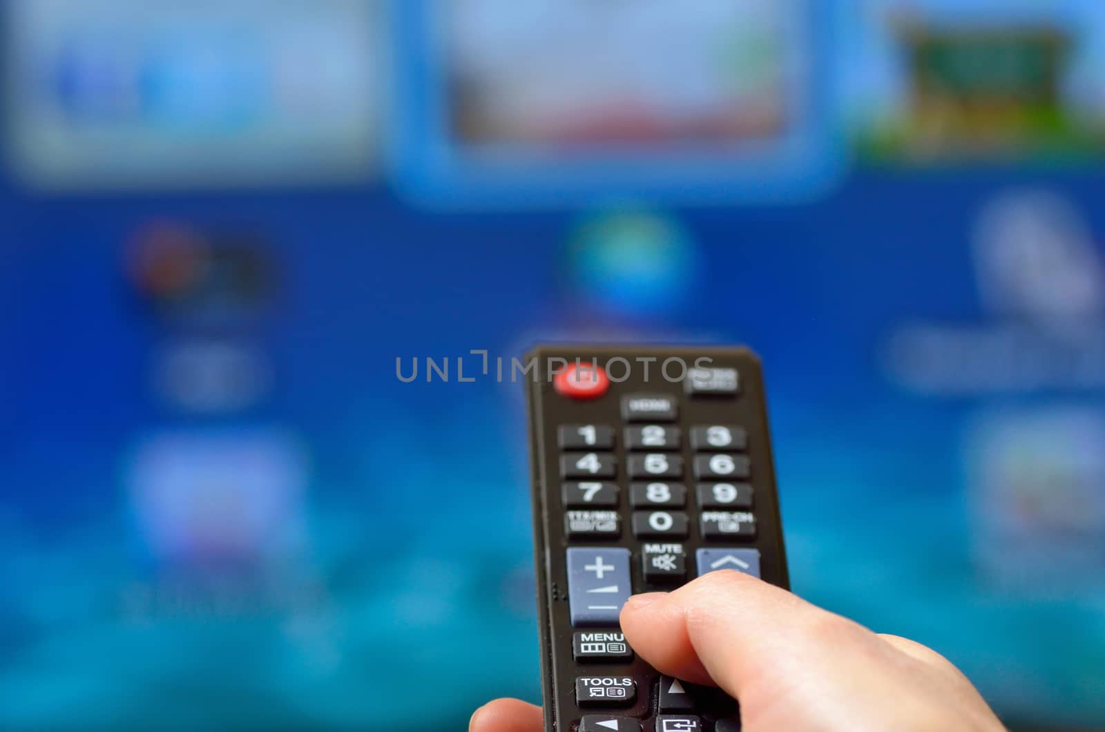 Woman  Holding Remote Control and Smart TV